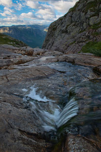 Scenic view of water flowing through rocks