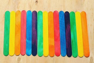 Directly above shot of colorful balls on wood