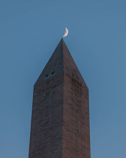 Low angle view of building against blue sky