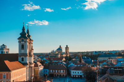 View of buildings in city against sky