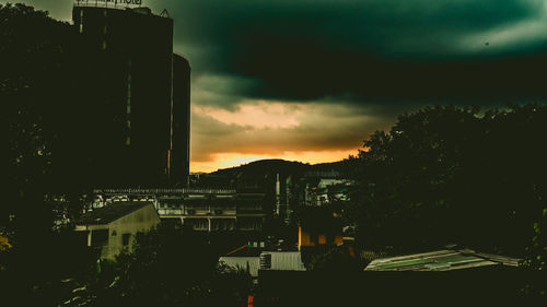 High angle view of buildings against sky at sunset