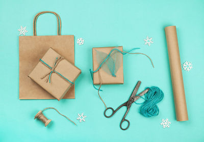 Directly above shot of christmas presents and gift box on red background