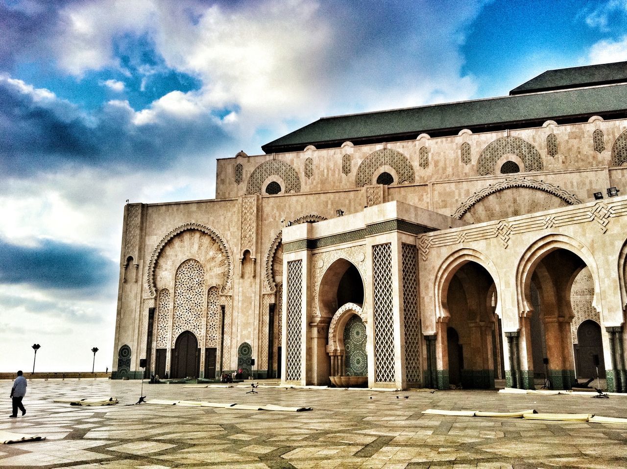 architecture, built structure, arch, building exterior, sky, history, place of worship, religion, travel destinations, famous place, cloud - sky, travel, spirituality, facade, tourism, entrance, church, cloud