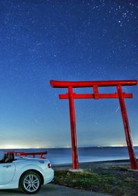 Lifeguard hut on street against sky at night