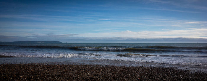 Scenic view of beach against sky