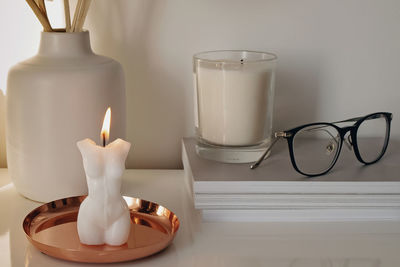 Modern trendy interior details close-up. burning candle, home decor