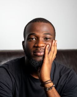 Portrait of young man against white background