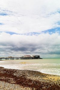 Pier over sea against sky