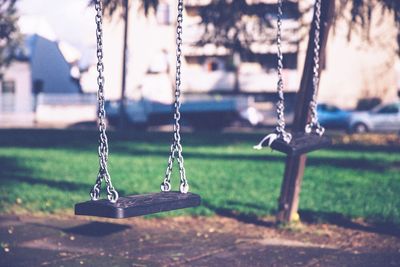 Close-up of swing in park