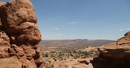 Rock formations on landscape against sky