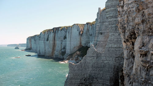 Panoramic view of sea and rocks against sky