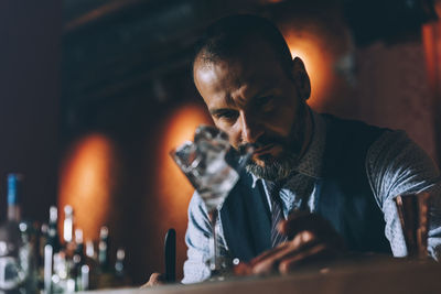 Bartender preparing cocktail in bar