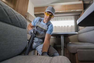 Portrait of man working in car