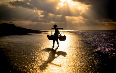 Sea salt farmer at bali, indonesia