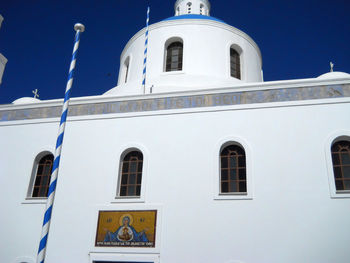 Low angle view of white building against sky