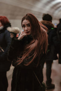 Young woman standing in snow