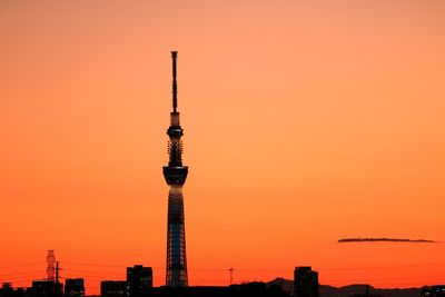 Tokyo sky tree against orange clear sky