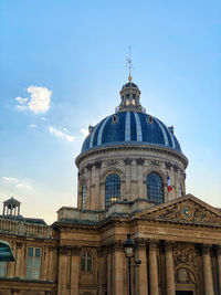 Paris france view of the institut de france on a sunny day along the seine river, architecture 