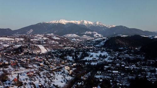 Bucegi mountains seen from the city of bran, romania. beautiful winter landscape. 
