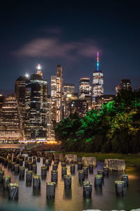 Illuminated modern buildings in city at night