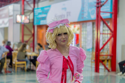 Woman with pink umbrella