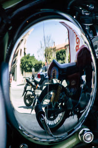 Reflection of bicycle on side-view mirror