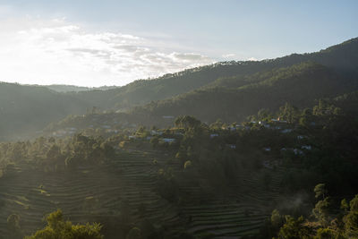 Scenic view of landscape and mountains against sky