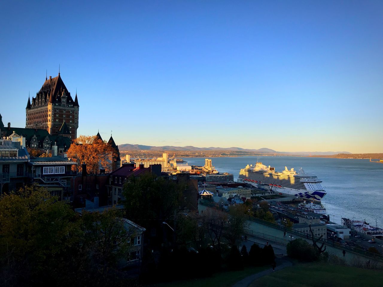 building exterior, architecture, built structure, sky, city, building, nature, water, copy space, no people, travel destinations, clear sky, high angle view, travel, the past, sunset, history, religion, blue, outdoors, cityscape