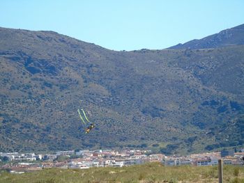 Scenic view of mountains against clear blue sky