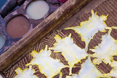 High angle view of maple leaves on wood