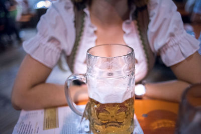 Midsection of woman holding drink