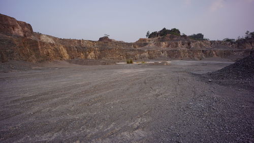 Scenic view of arid landscape against clear sky