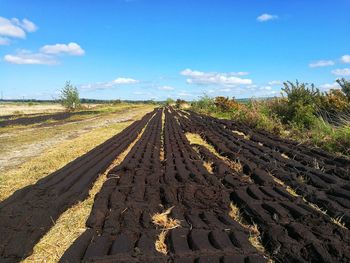 Panoramic view of mud on farm against sky