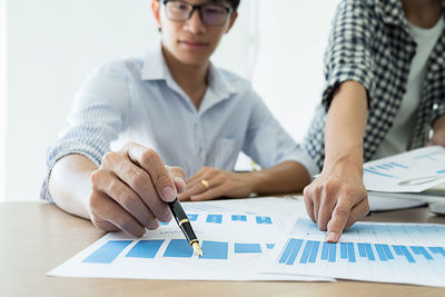 Low angle view of man working on table