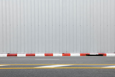 Traffic cones on road against sky