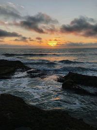 Scenic view of sea against sky during sunset