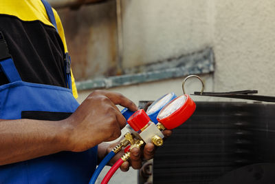 Cropped hand of man using mobile phone