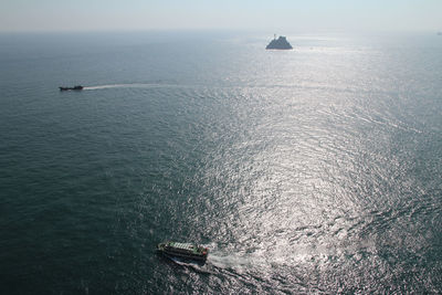 High angle view of ship sailing on sea against sky