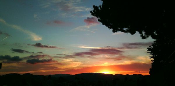 Silhouette of landscape against dramatic sky