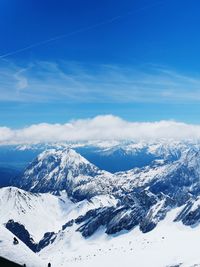 Scenic view of snowcapped mountains against sky