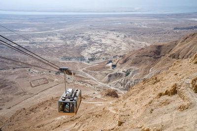 High angle view of telephone booth on landscape against sky