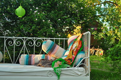 Close-up of cropped sofa against trees