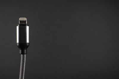 Close-up of electric lamp against black background