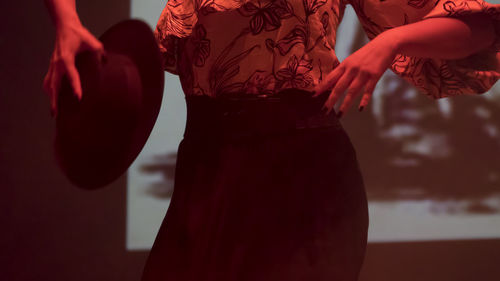 Midsection of woman dancing on stage