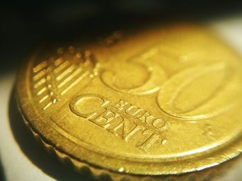 Close-up of coins on metal