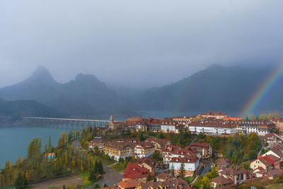 View of the town of riaño during autumn a rainy day with rainbows