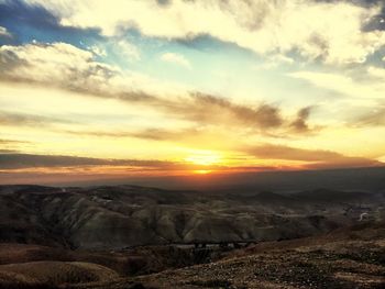 Scenic view of landscape against sky during sunset