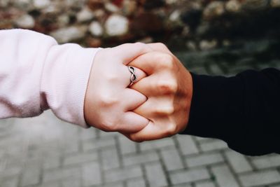 Close-up of hand holding hands