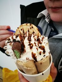 Close-up of man holding ice cream