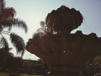 Low angle view of fountain against clear sky